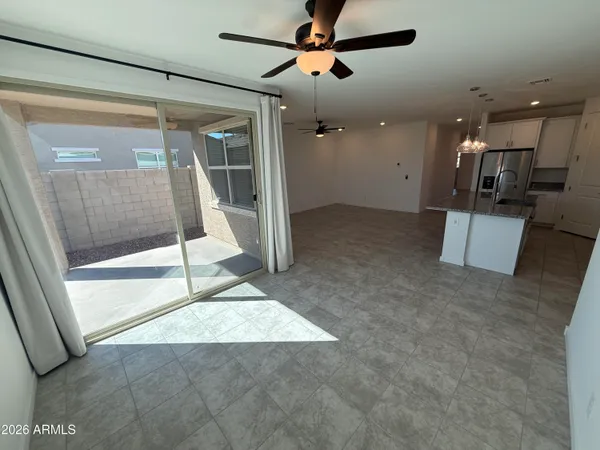 a kitchen with stainless steel appliances granite countertop a sink a stove and a refrigerator