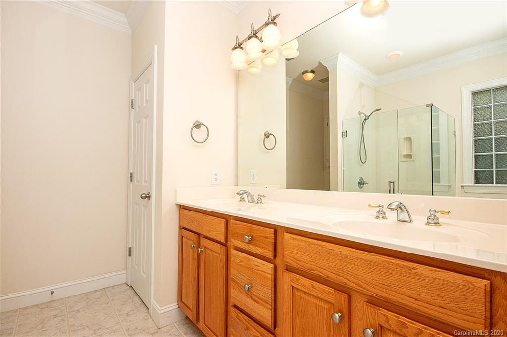 644 Bracket Street, Unit 513 Fort Mill, SC 29708 - Photo 14 of 19 a bathroom with a sink and a mirror
