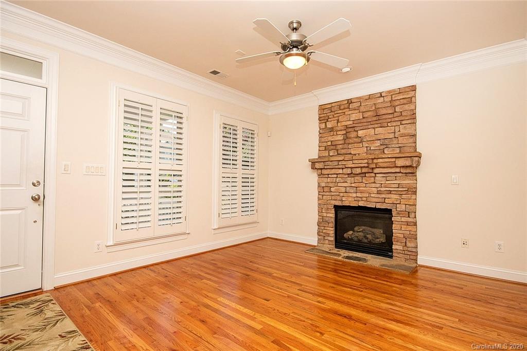 644 Bracket Street, Unit 513 Fort Mill, SC 29708 - Photo 4 of 19 a view of an empty room with a fireplace and a window