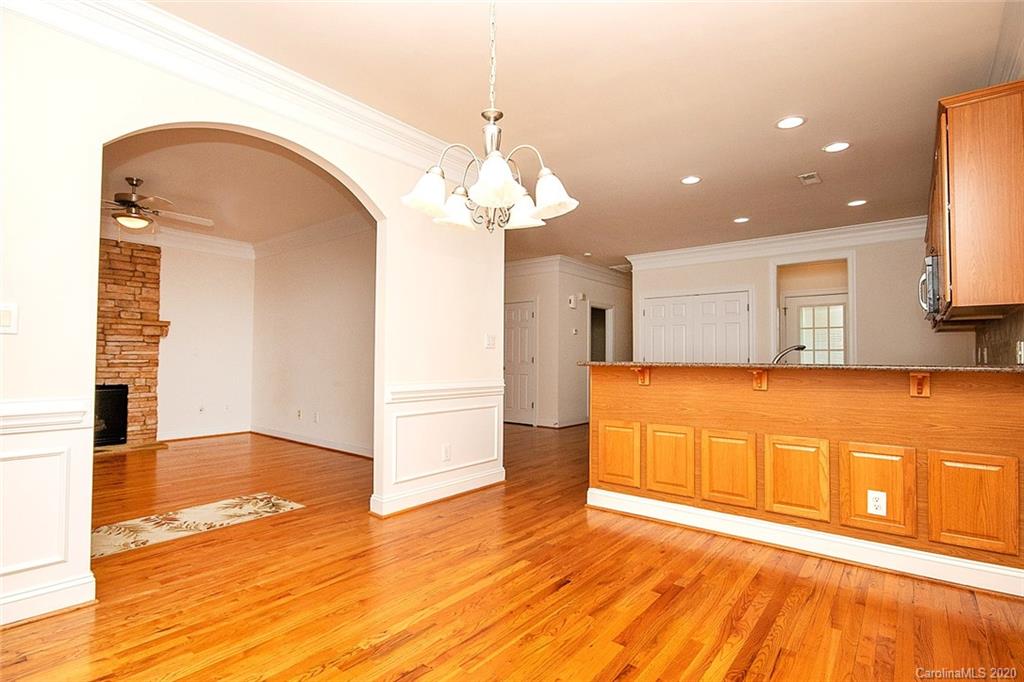 644 Bracket Street, Unit 513 Fort Mill, SC 29708 - Photo 5 of 19 a view of a kitchen with a sink and wooden floor