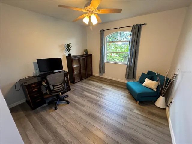 a living room with furniture and a window