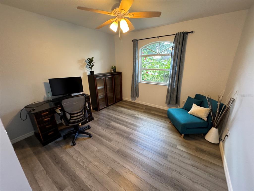 2466 Logsdon Street North Port, FL 34287 - Photo 13 of 18 a living room with furniture and a window