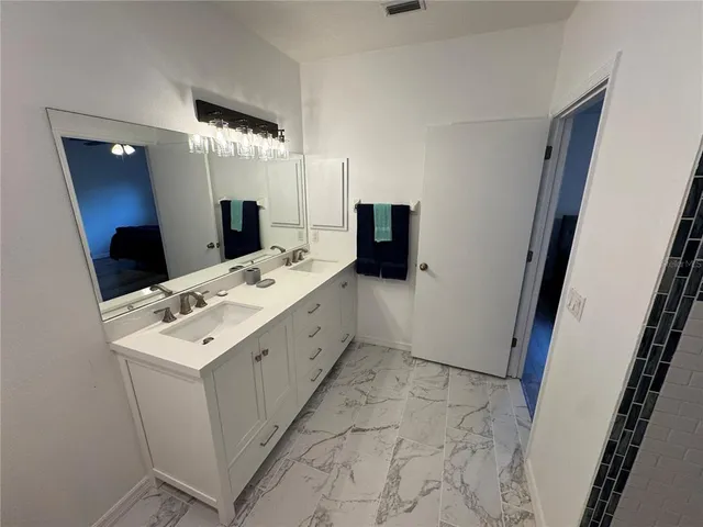 a utility room with a sink a washer and dryer