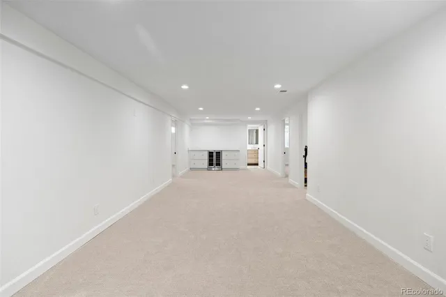 a big room with closet and windows