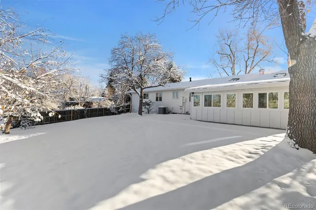 a view of house with outdoor space and sitting area