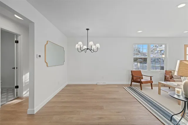 a view of a livingroom with furniture wooden floor and a window