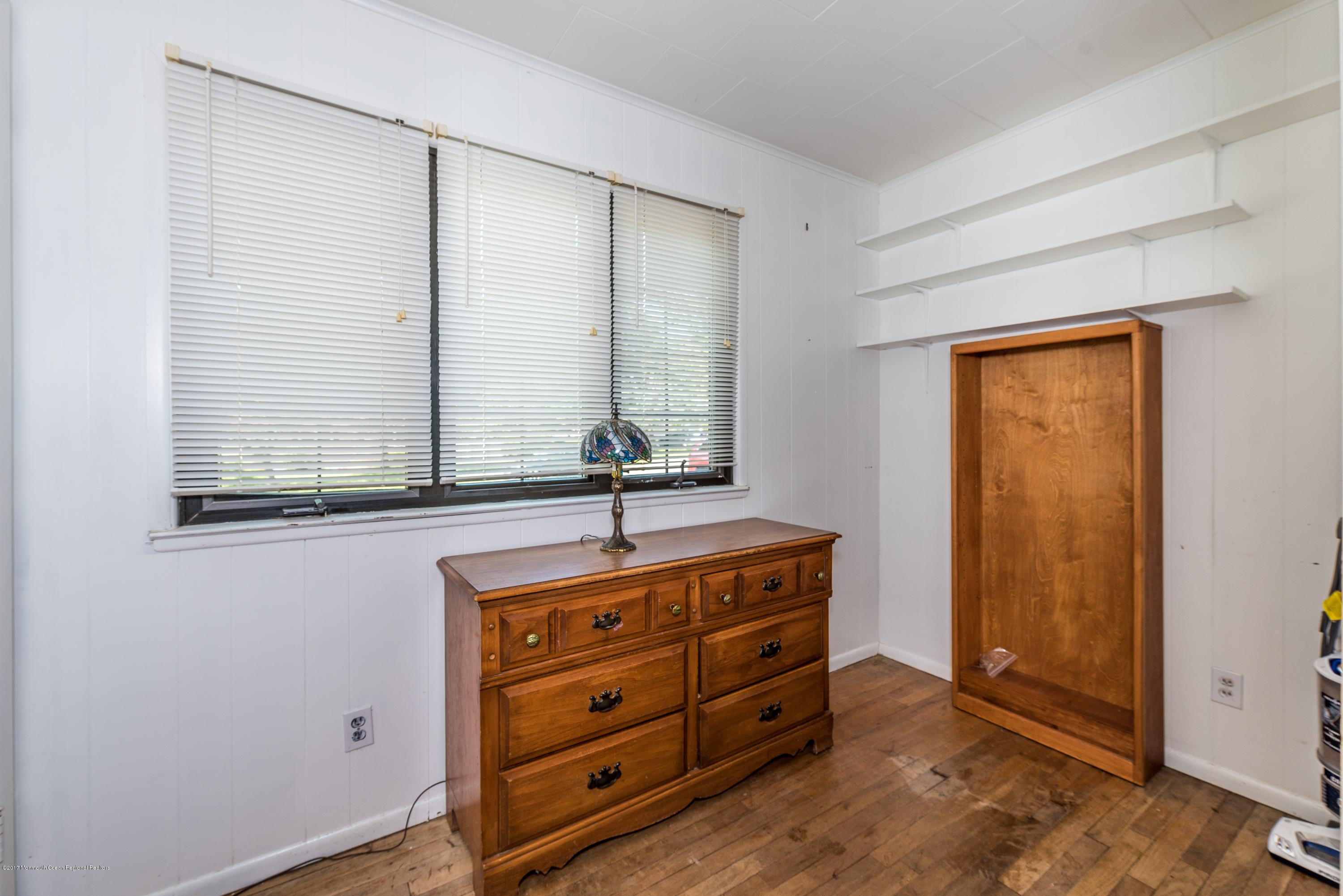 4 Hemlock Road Howell, NJ 07731 - Photo 11 of 15 a room with window closet and couch