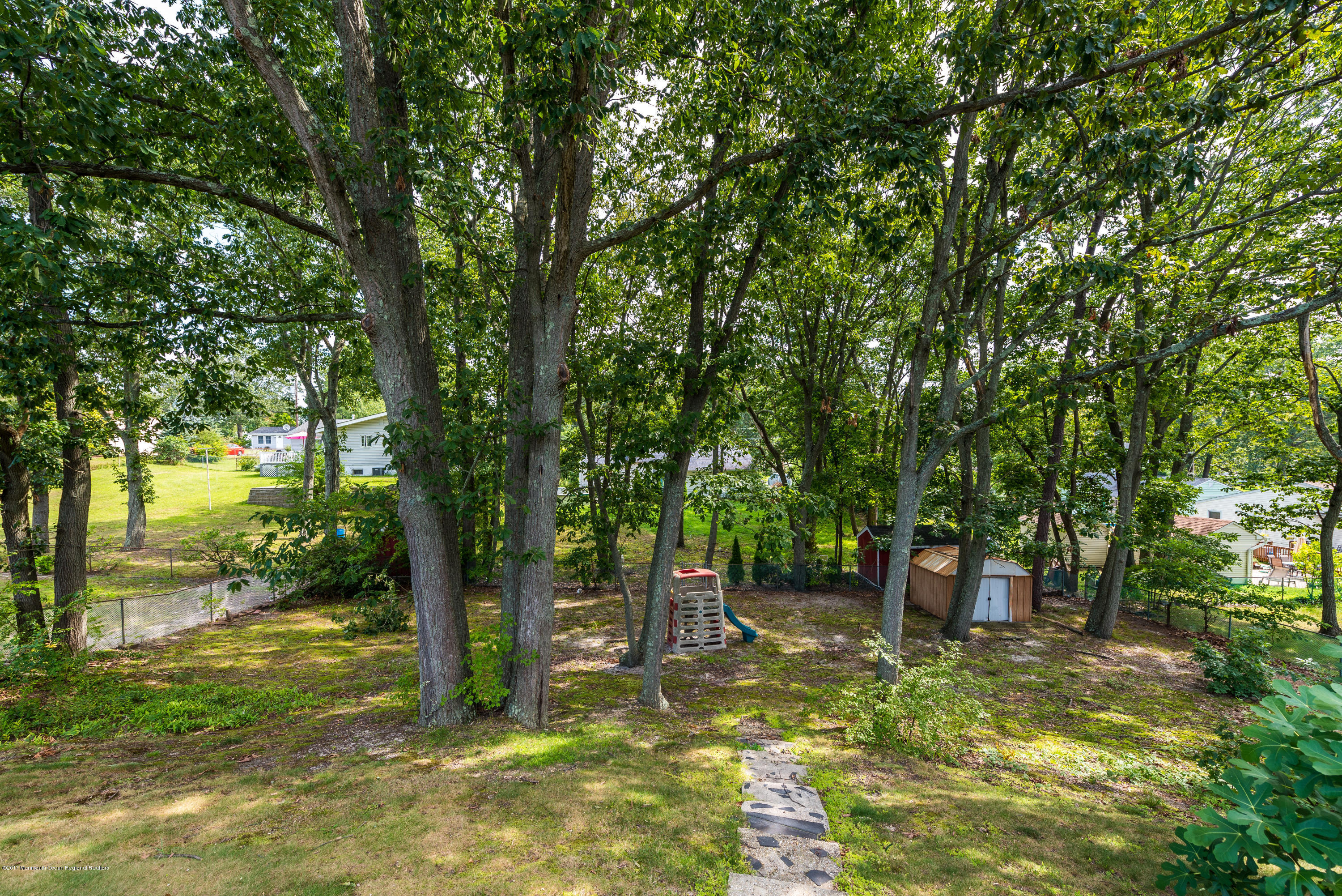 4 Hemlock Road Howell, NJ 07731 - Photo 14 of 15 a view of a garden with trees