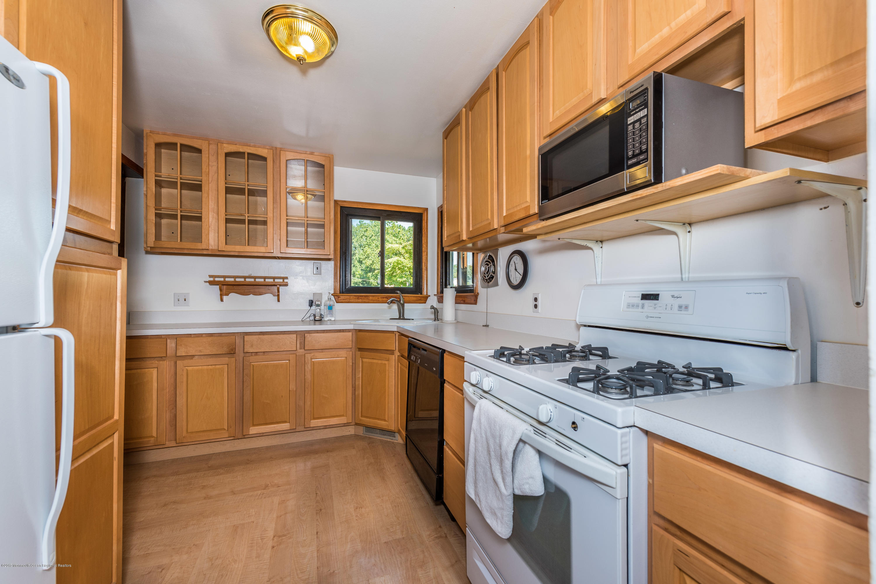 4 Hemlock Road Howell, NJ 07731 - Photo 4 of 15 a kitchen with stainless steel appliances granite countertop a stove and a sink