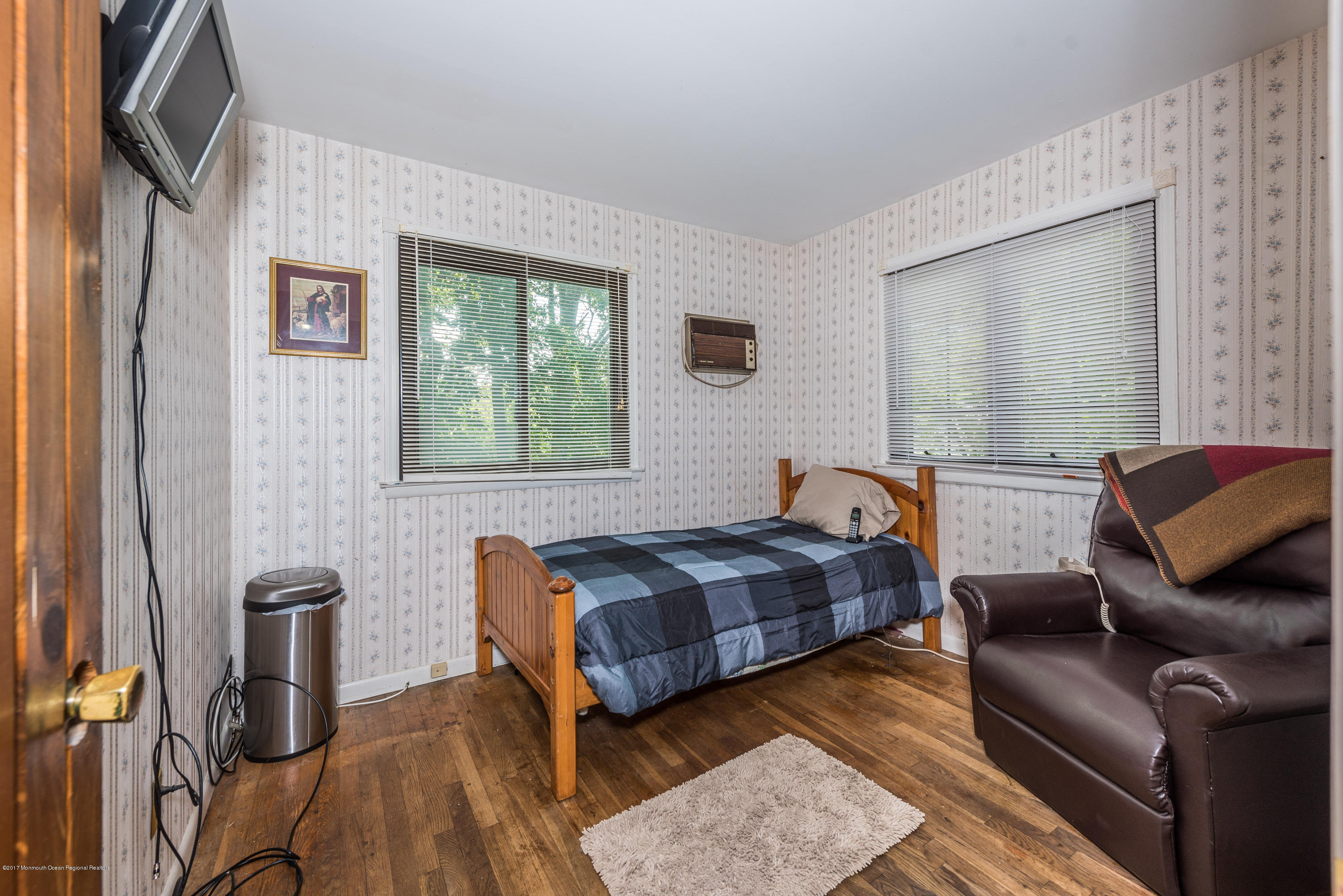 4 Hemlock Road Howell, NJ 07731 - Photo 10 of 15 a bedroom with a bed and wooden floor
