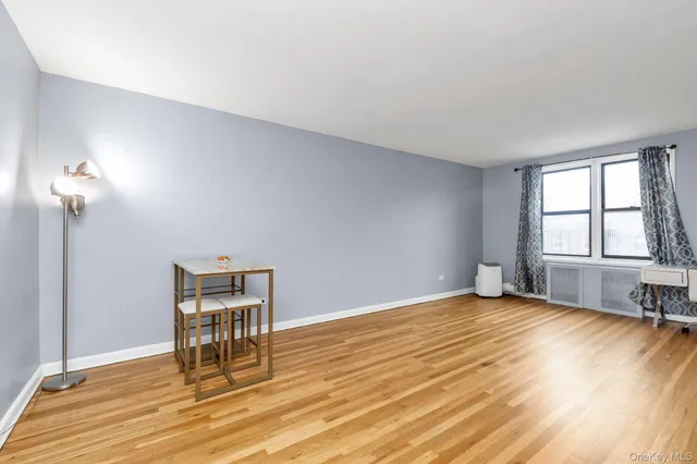 a view of work room with wooden floor and fan