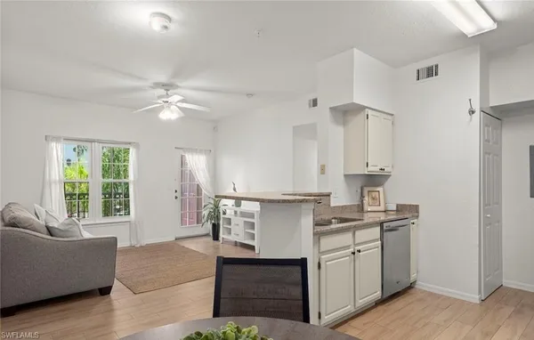 a house with a clock tower in front of it