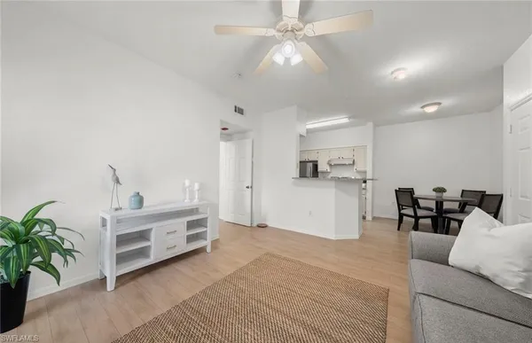 a view of a street with a building in the background