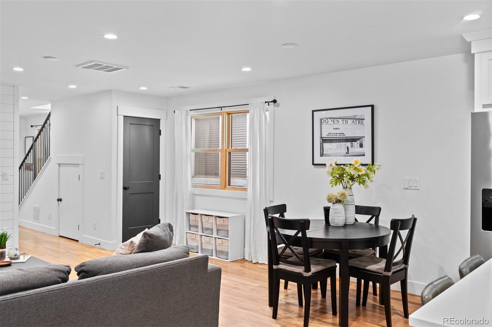 333 Delaware Street Denver, CO 80223 - Photo 11 of 44 a view of a dining room with furniture and a potted plant