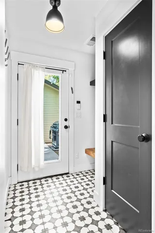 a bathroom with a glass shower door