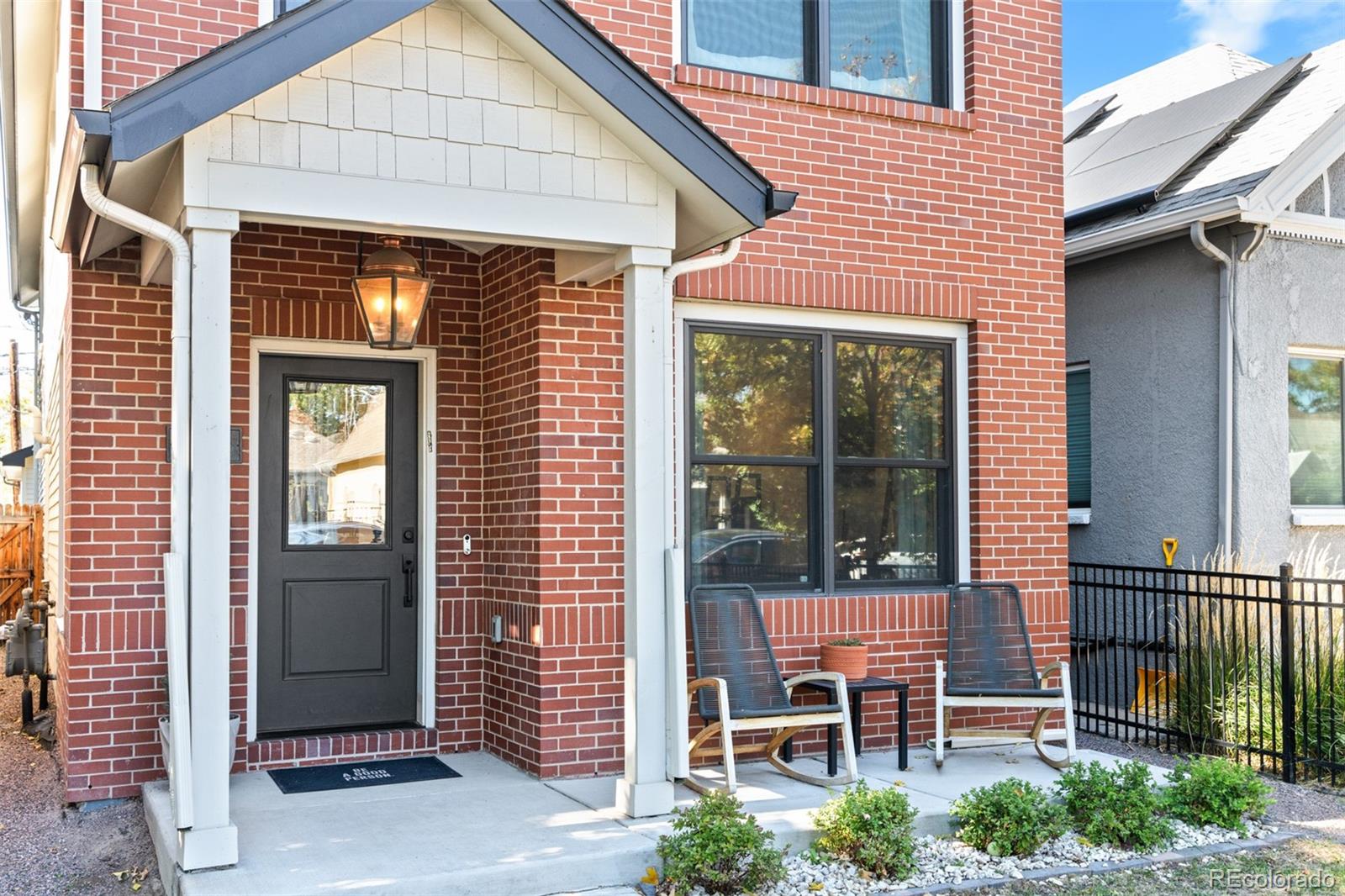 333 Delaware Street Denver, CO 80223 - Photo 2 of 44 a front view of a house with a porch