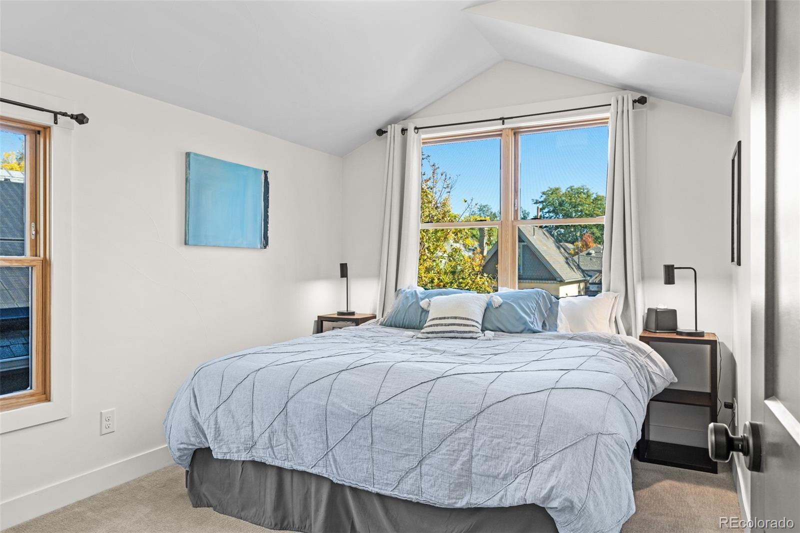 333 Delaware Street Denver, CO 80223 - Photo 31 of 44 a bedroom with a bed and window