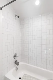 a bathroom with a sink and a bathtub