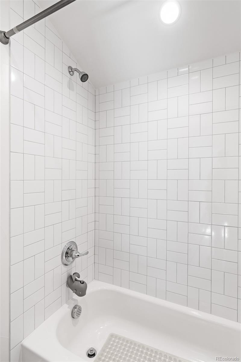 333 Delaware Street Denver, CO 80223 - Photo 37 of 44 a bathroom with a sink and a bathtub