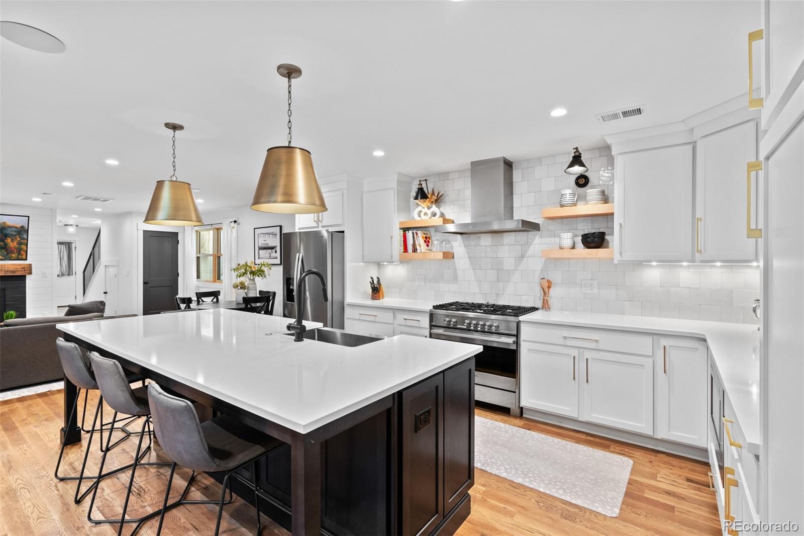 333 Delaware Street Denver, CO 80223 - Photo 4 of 44 a kitchen that has a table and chairs in it