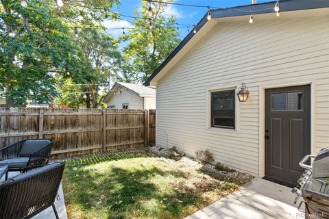 a backyard of a house with seating space