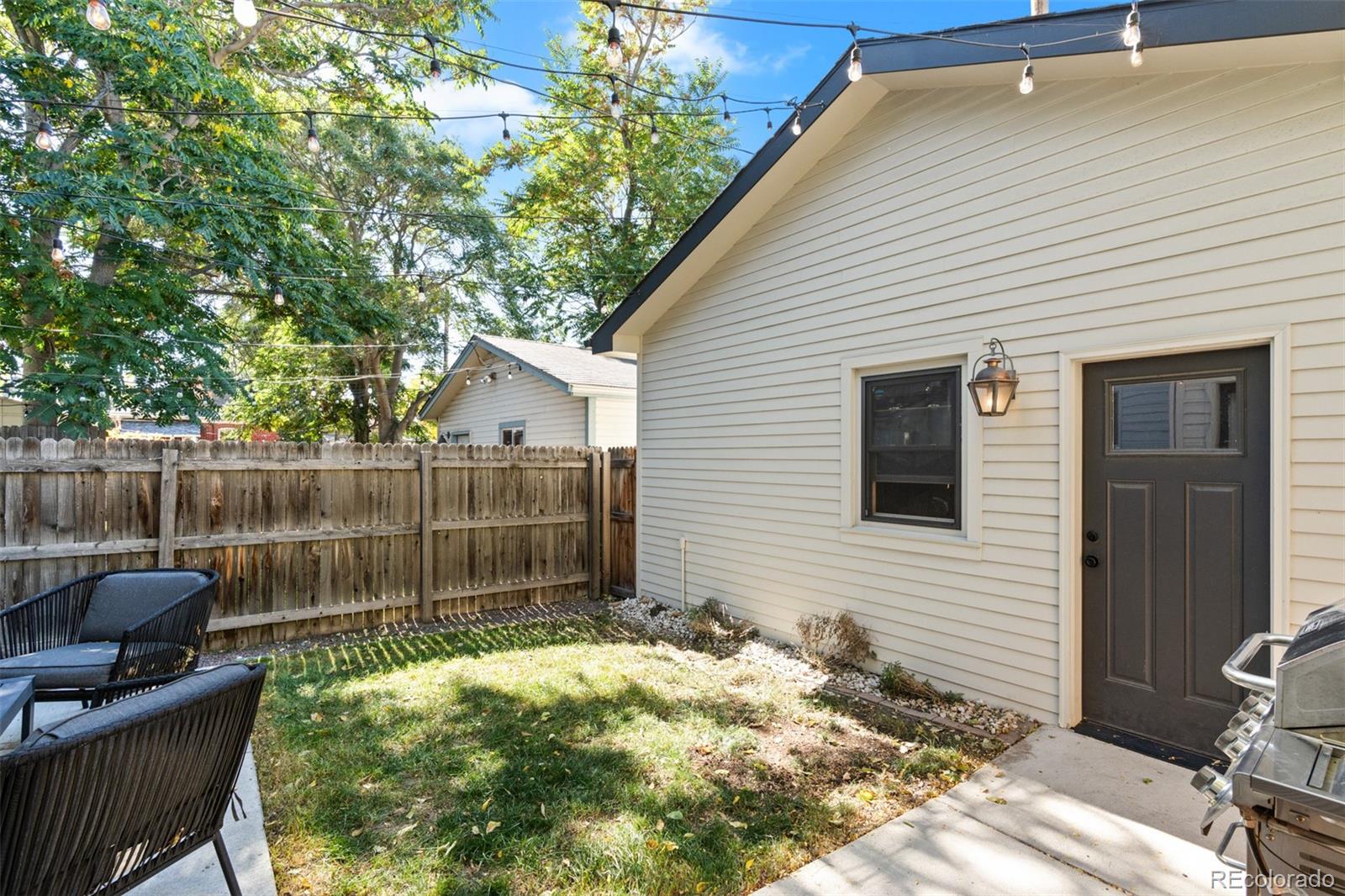 333 Delaware Street Denver, CO 80223 - Photo 42 of 44 a backyard of a house with seating space