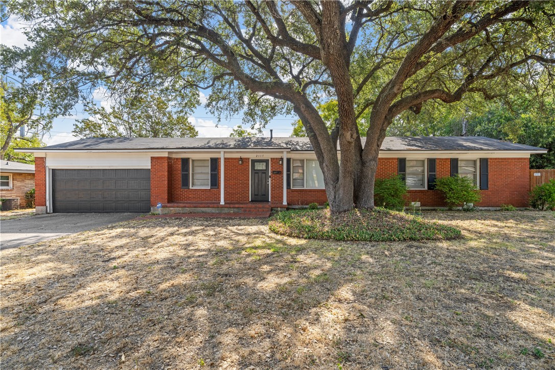 a house with trees in front of it