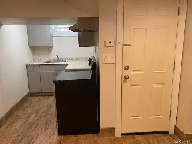 a kitchen with a sink and a refrigerator