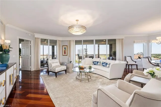 a living room with furniture dining table and a window
