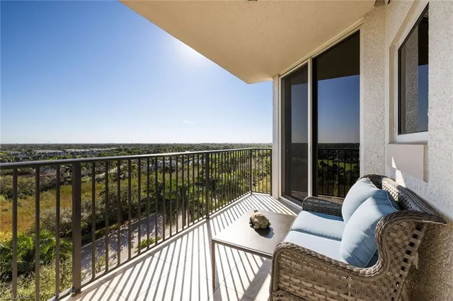 a view of balcony with couch and wooden floor