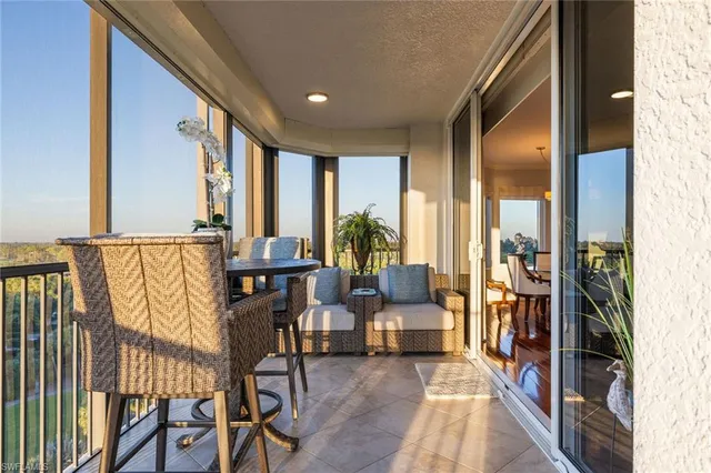 a view of an entryway with furniture and floor to ceiling window