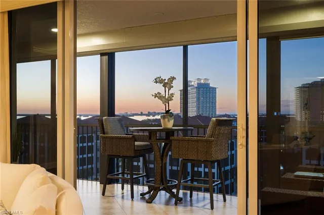 a view of a dining room with furniture and window