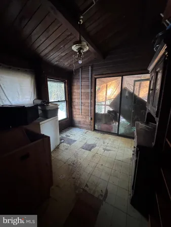 a living room with furniture a window and a fireplace