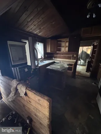 a view of kitchen and dining room with furniture