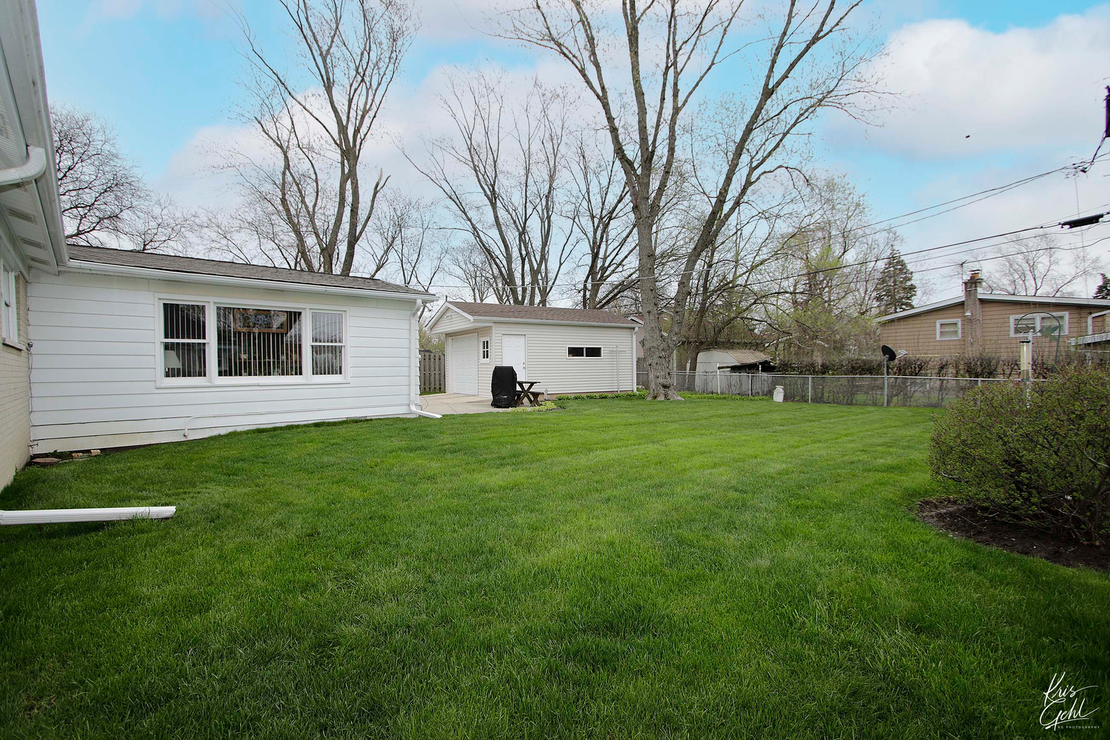 514 Warren Road Glenview, IL 60025 - Photo 17 of 21 a white house that has a tree in it