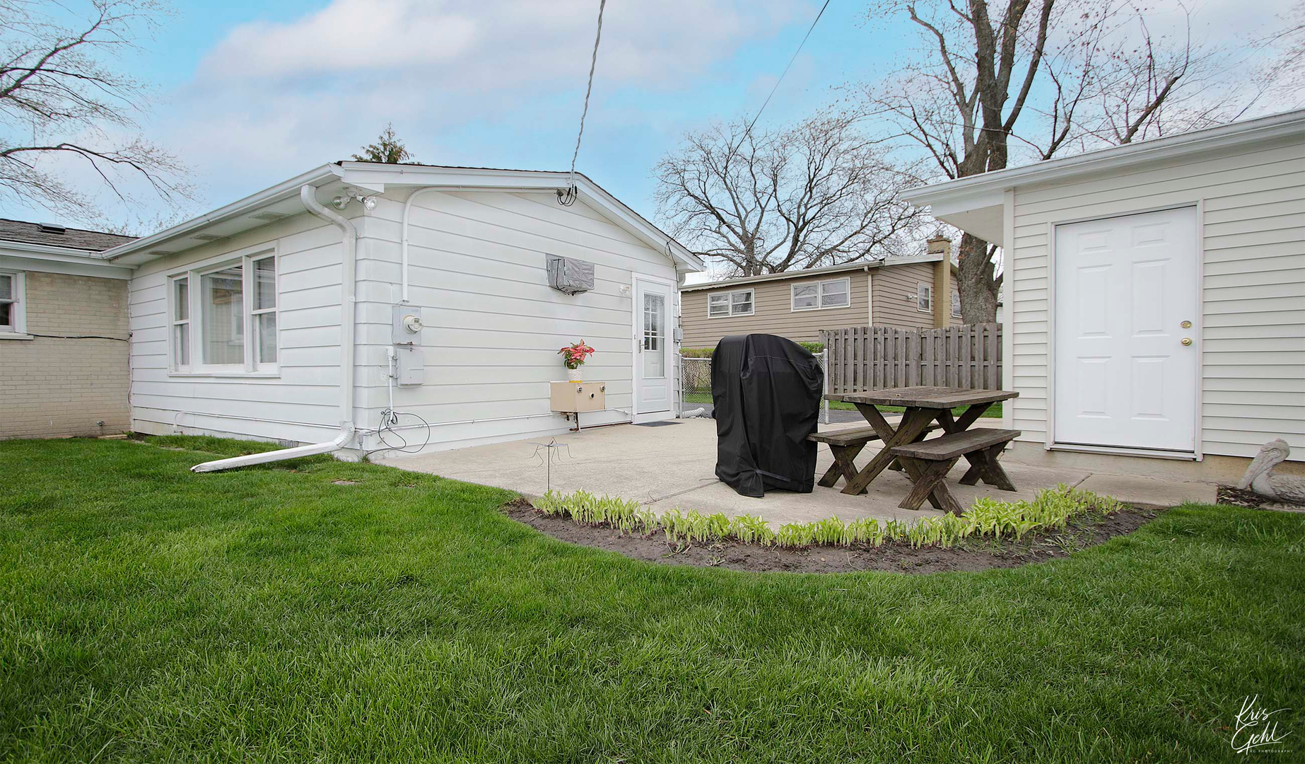 514 Warren Road Glenview, IL 60025 - Photo 18 of 21 a view of a backyard with sitting area and slide