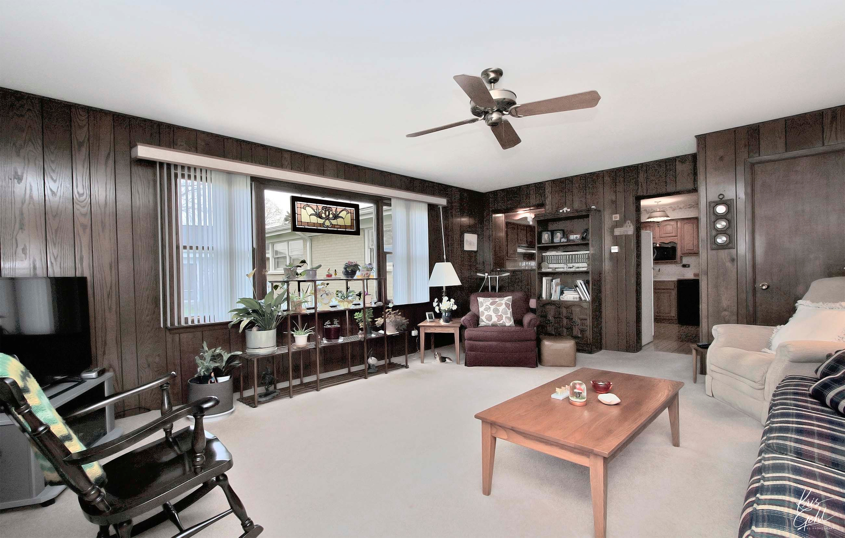 514 Warren Road Glenview, IL 60025 - Photo 10 of 21 a living room with furniture and a flat screen tv