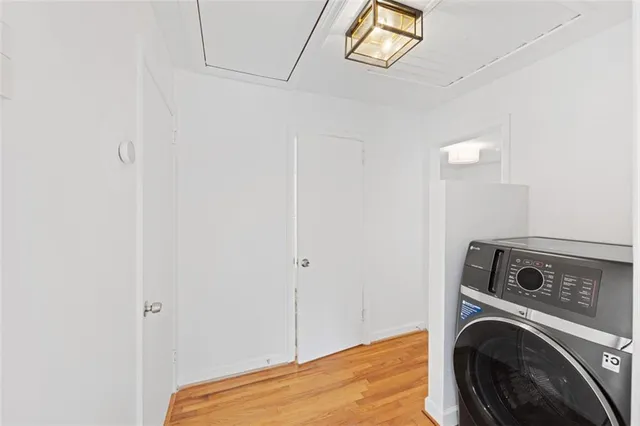 a view of a bedroom with washer and dryer