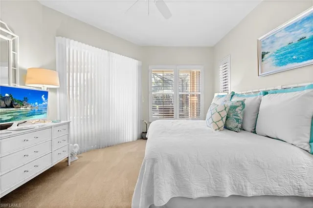 a large white bed in a white room