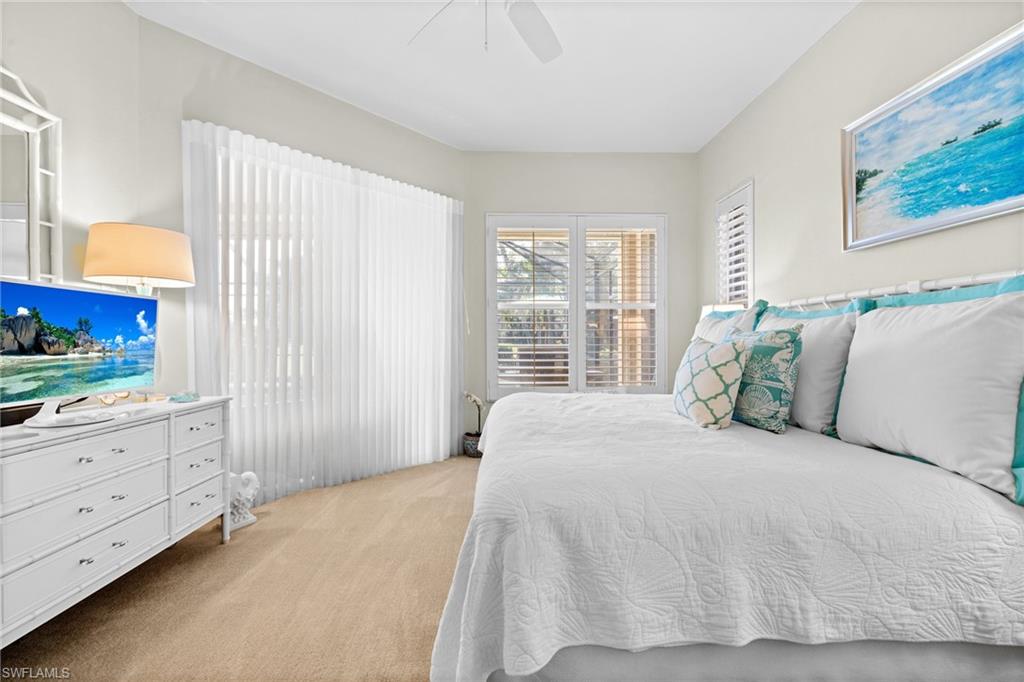 6737 Bent Grass Drive Naples, FL 34113 - Photo 15 of 31 a large white bed in a white room