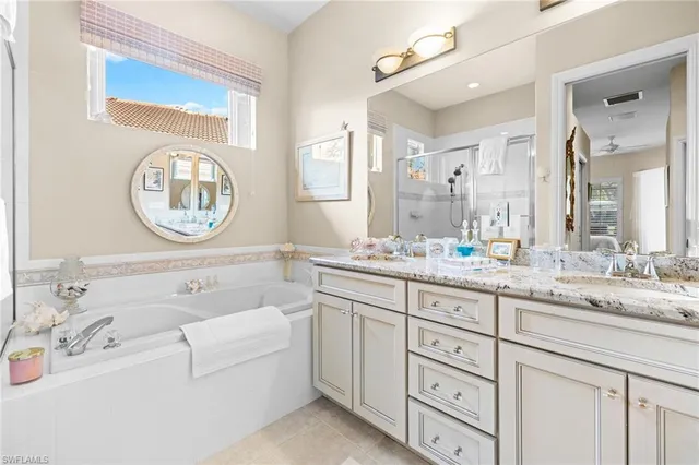 a bathroom with a sink and a large mirror