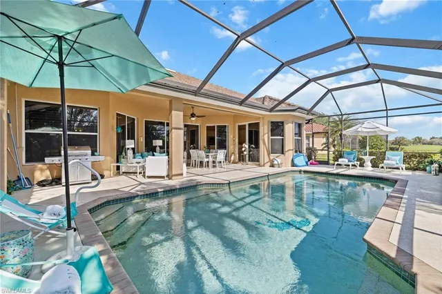 a view of a swimming pool with a patio