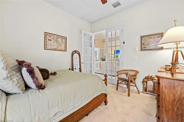 a bedroom with bed and a table