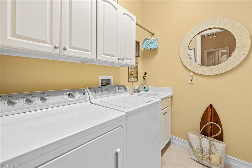 6737 Bent Grass Drive Naples, FL 34113 - Photo 27 of 31 a utility room with dryer and washer