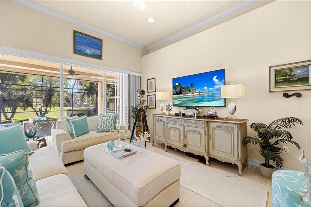 6737 Bent Grass Drive Naples, FL 34113 - Photo 6 of 31 a living room with furniture and a flat screen tv