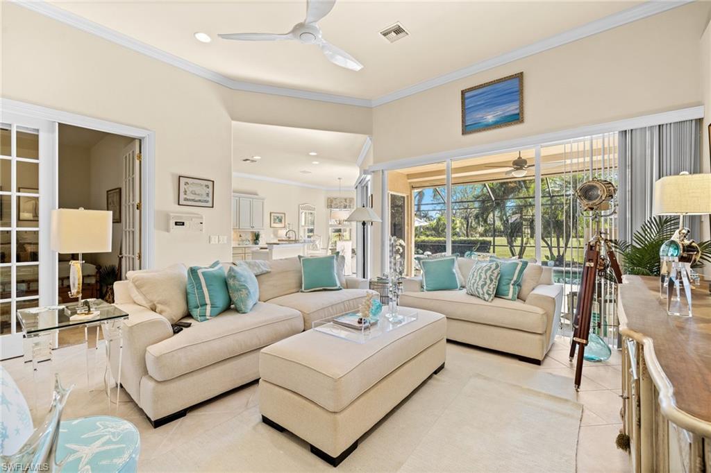 6737 Bent Grass Drive Naples, FL 34113 - Photo 7 of 31 a living room with furniture and a large window