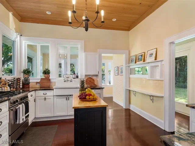 a kitchen with a sink stainless steel appliances and cabinets