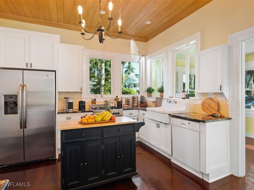 101 Fairview Avenue Fort Myers, FL 33905 - Photo 13 of 34 a kitchen with stainless steel appliances granite countertop a sink and a refrigerator