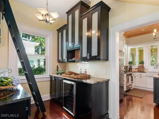 a view of a kitchen with furniture and a chandelier