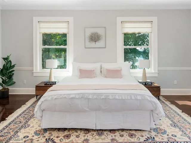 a bedroom with bed and window